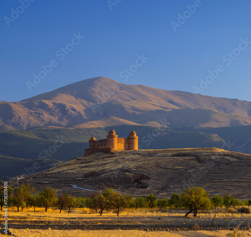 La Calahorra castle with Sierra Nevada, Andalusia, Spain photo