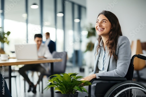portrait of a caucasian businesswoman in a wheelchair, smiling. Inclusive office.  photo