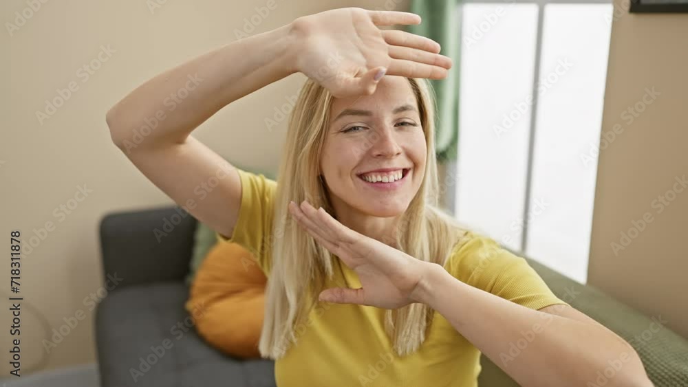 Cheerful young blonde woman at home, capturing hearts with her sparkling eyes, happily playing peek a boo showing face, wearing casual t-shirt and sharing excited, joyful moments indoors. Cheerful young blonde woman at home, capturing hearts with her sparkling eyes, happily playing peek a boo showing face, wearing casual t-shirt and sharing excited, joyful moments indoors.