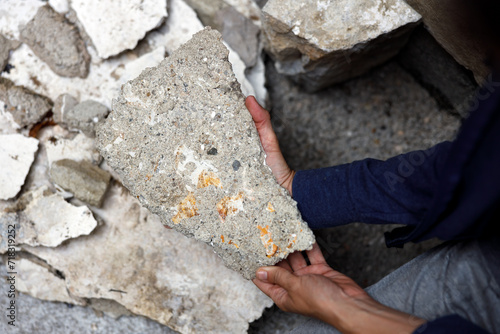 Restorer Showing parts of a Baroque Painting on Removed Additional Plasters of Wall - From this pieces is possible to restore an Ancient piece of History photo