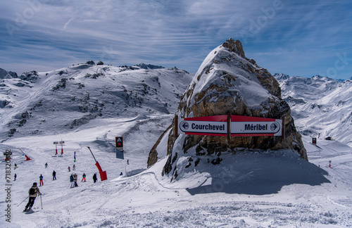 Winter vacation at the ski resort in France. Beautiful sunny day and amazing landscape around, sign Courchevel Meribel.