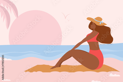 Girl in a pink swimsuit. A young woman spends her vacation on the seashore.