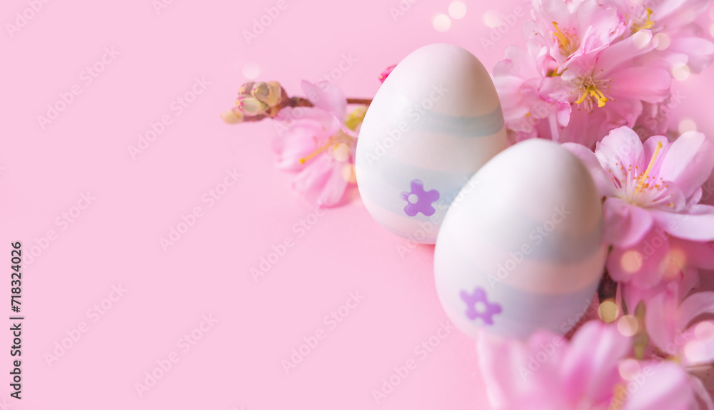 Close up of easter eggs and cherry flowers on a pink background with bokeh and copy space. Church Christian holidays, Christianity, Easter background Close up of easter eggs and cherry flowers on a pink background with bokeh and copy space. Church Christian holidays, Christianity, Easter background