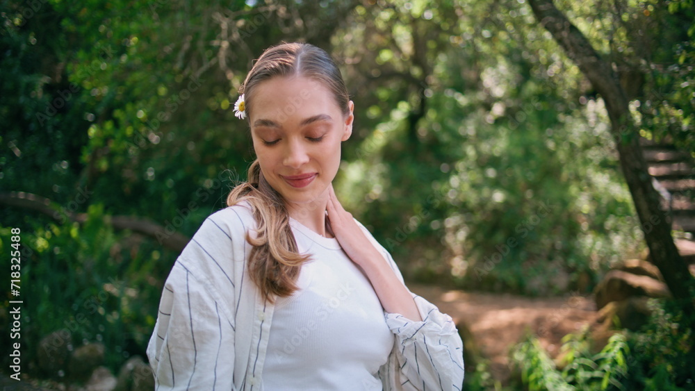 Beautiful model walking forest smiling gently closeup. Cute woman strolling park Beautiful model walking forest smiling gently closeup. Cute woman strolling park