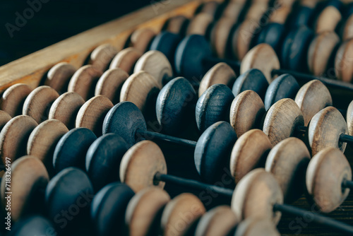 Vintage wooden abacus lying on the table , closeup
