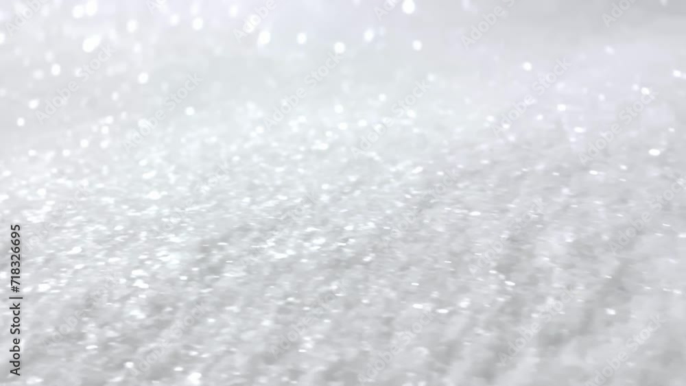 The shiny snow sparkles in the light. The shiny snow sparkles in the light.
