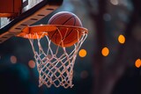 Close Up of an Orange Basketball Going Through a Basketball Hoop with Blurred Background 