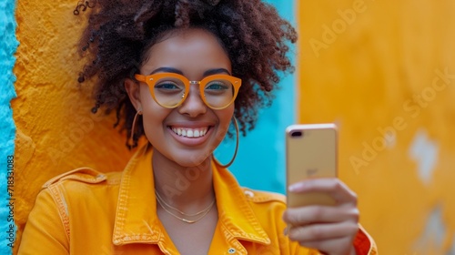 an african american woman pointing her finger while pointing to her smart phone