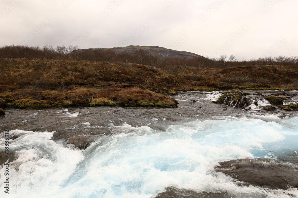 Brúará is a spring-fed river in West Iceland which runs by the boundaries of municipalities Biskupstungur and Grímsnes