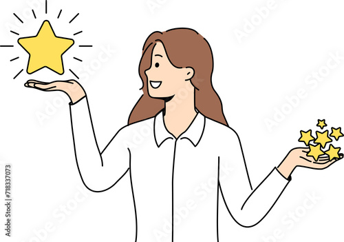 Woman holds rating stars in hands and chooses what rating to give to restaurant on website with reviews. Smiling girl in libra pose encourages you to evaluate your user experience with company
