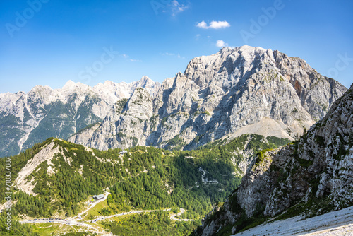 Vrsic Pass and Prisojnik, or Prisank, Mountain. Sunny day in Julian Alps, Slovenia photo