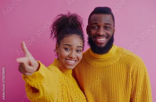 couple in a yellow sweater making a hand gesture