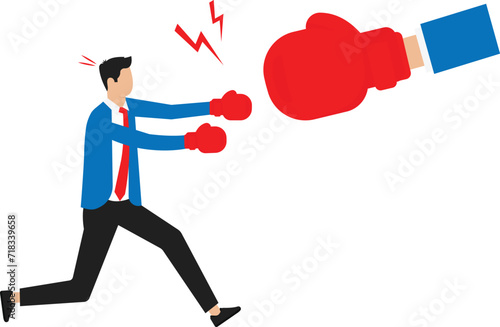 Businessman boxing with big hand of unfair competition. Man in boxing gloves fighting and Confrontation between employee and boss or manager.
