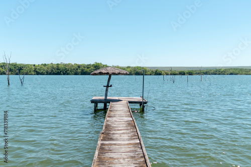 Lonely pier im the middle of a sunny lake