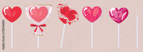 Set of sweet lollipops in shape of heart on grey background
