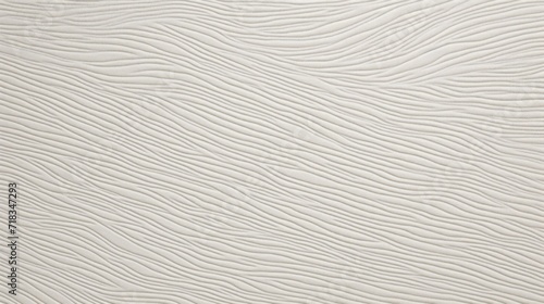  a close up of a white textured wallpaper with a black and white cat laying on top of it.