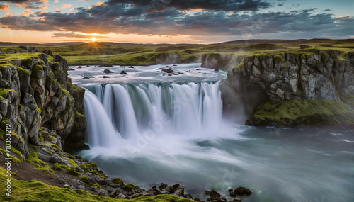 Scenic view of waterfall in iceland at sunset. Travel and adventure concept background. © Shootdiem