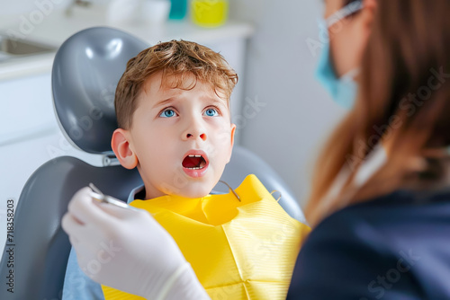 A child sitting in a dental chair with a dentist examining their teeth