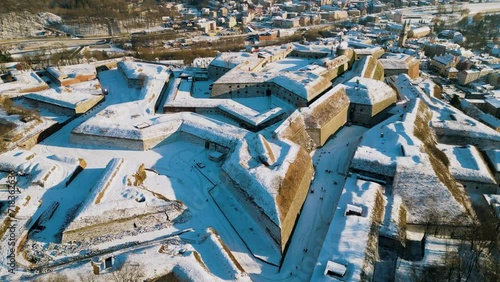 Fortress Klodzko and old town cityscape, aerial view. Famous historical landmark, fortification complex of the Lower Silesian Voivodeship. The biggest stronghold in Prussian Silesia. Winter panorama.
