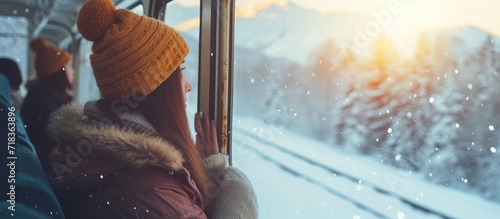 Beauty woman traveler looks out from window train view beautiful winter mountains landscape.