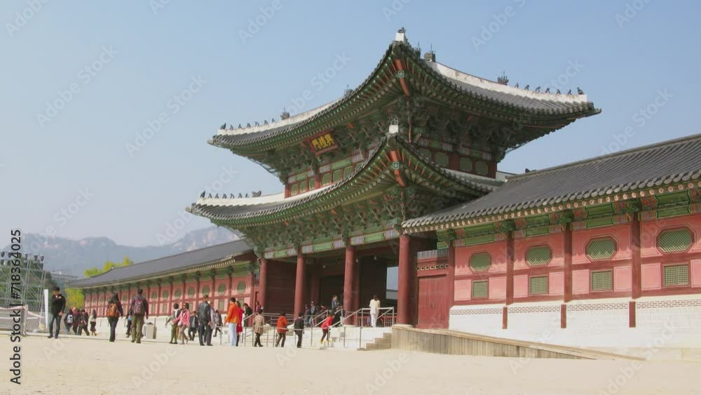 Many people walk near entrance of Geyongbokgun Palace at autumn Many people walk near entrance of Geyongbokgun Palace at autumn