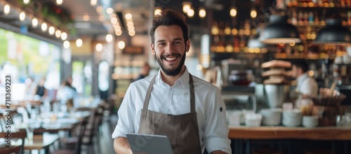 A Restaurant entrepreneur with tablet standing and a smile to customers.Generate AI image