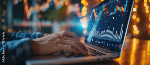 Businessman using laptop keyboard at desktop with digital analysis graph trade. AI generated image photo