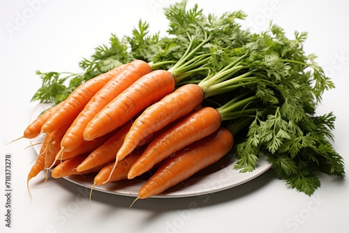 Bunch of fresh carrots with green parsley on a white background