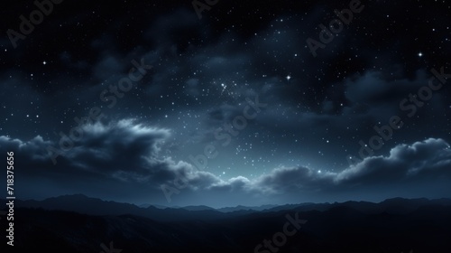  a night sky with stars and clouds and a mountain range in the foreground with mountains in the foreground. © Olga