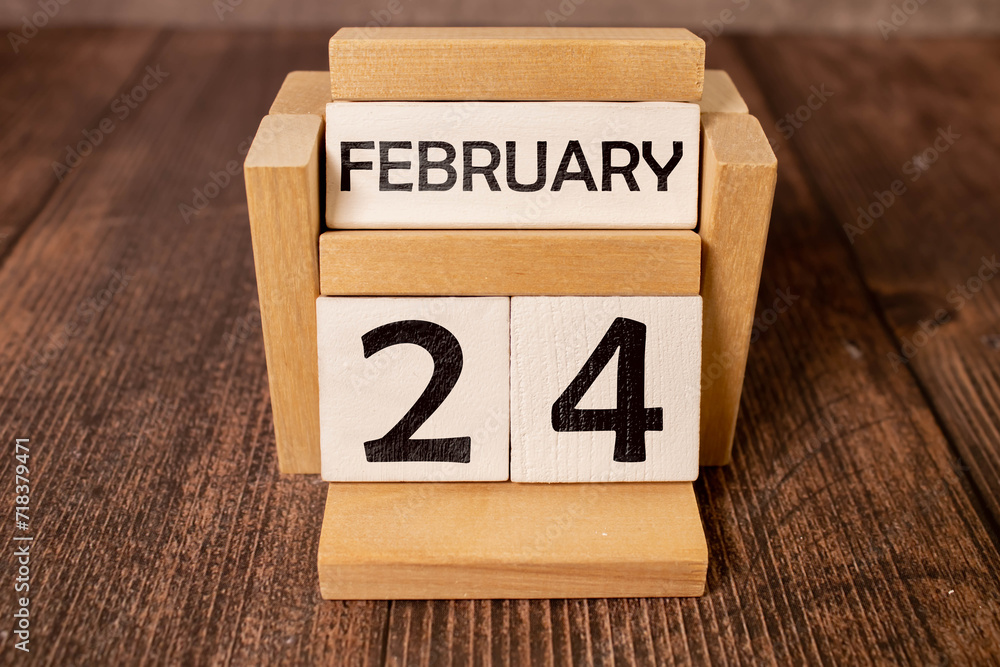 24 Februar on wooden grey cubes. Calendar cube date 24 February. Concept of date. Copy space for text or event. 24 Februar on wooden grey cubes. Calendar cube date 24 February. Concept of date. Copy space for text or event.