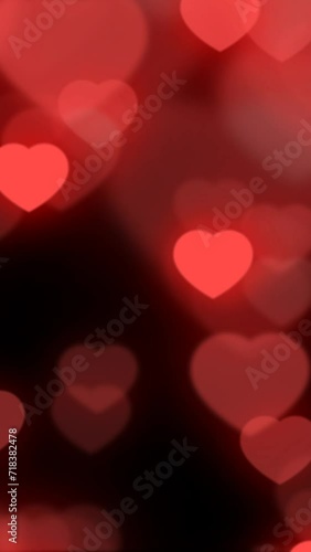 Wallpaper Mural 4K vertical video. Glowing neon beating red hearts of different sizes fly up on dark black background. Loop animation for February 14. Holiday of relationship, love, party. Happy Valentine's Day Torontodigital.ca