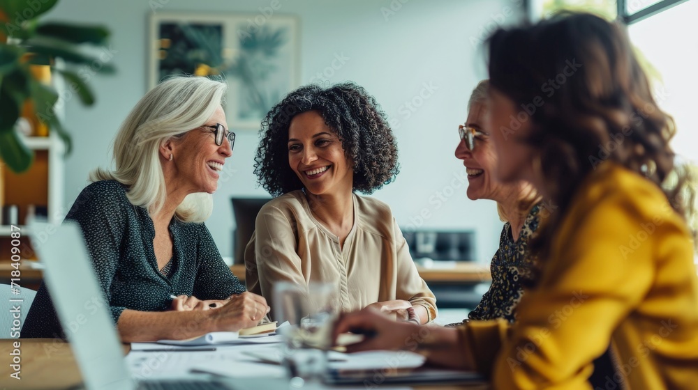 Multigenerational team of women at a productive business meeting Multigenerational team of women at a productive business meeting