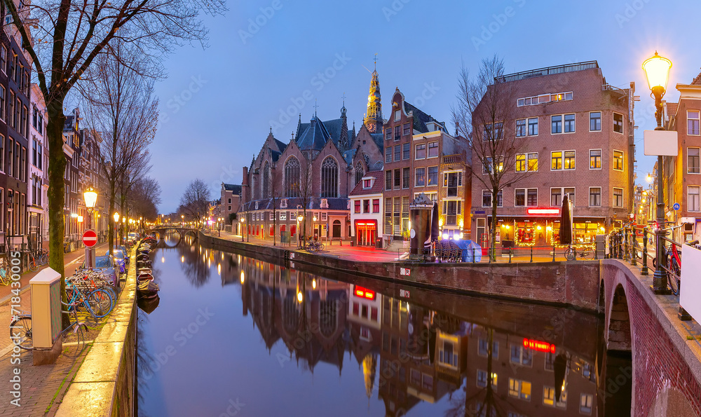 Canal De Wallen, famous red-light district in the twilight, Amsterdam, Holland, Netherlands.