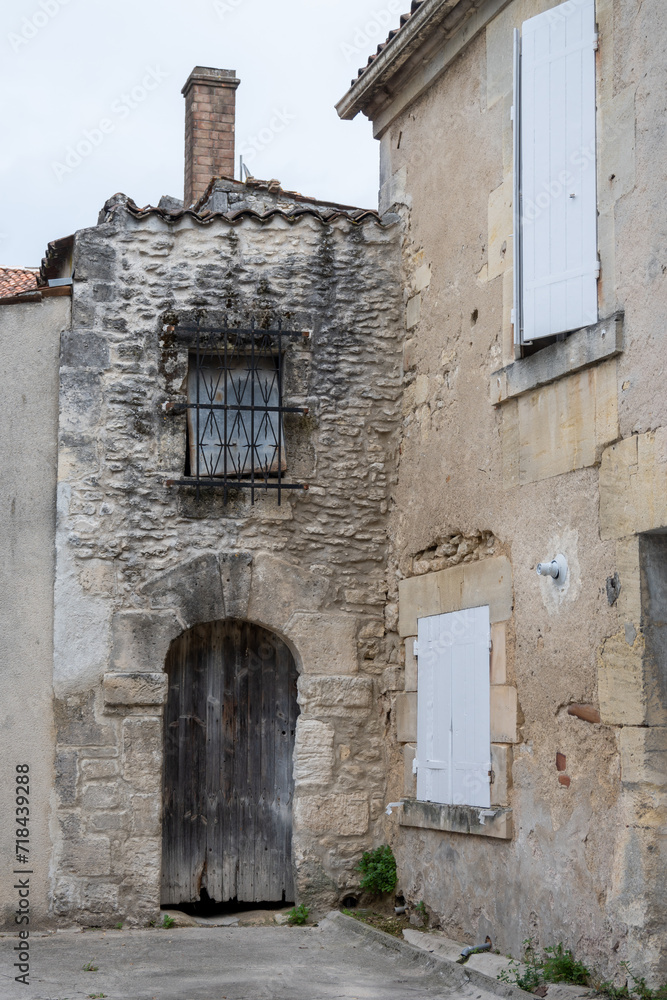 View on old streets and houses in Cognac white wine region, Charente, walking in town Cognac with strong spirits distillation industry, France