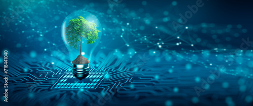 Tree with soil growing on  Light bulb. Digital Convergence and and Technology Convergence. Blue light and network background. Green Computing, Green Technology, Green IT, csr, and IT ethics Concept. photo