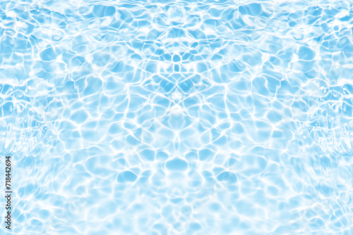 Bluewater waves on the surface ripples blurred. Defocus blurred transparent blue colored clear calm water surface texture with splash and bubbles. Water waves with shining pattern texture background.