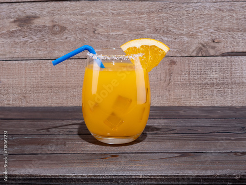 фотографія Orange Margarita with a salted rim.