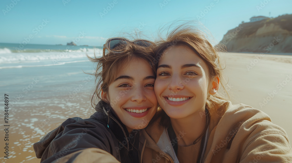 a couple happy lesbians go to the beach.