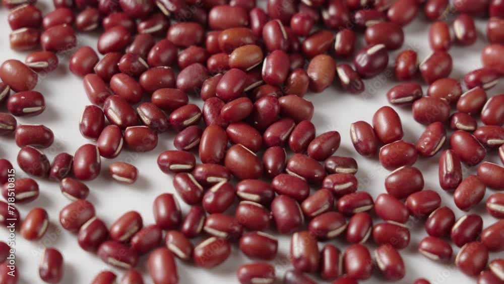 Raw red bean or azuki beans seeds on white background.
Raw red bean or azuki beans seeds on white background.