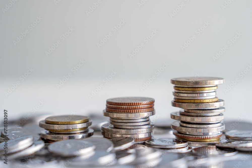 Growth of money coins stack. Background for Global economic, Business and financial growth, Goal to save money for retirement, Interest rates increase, Inflation, Budget and tax rise concept. Growth of money coins stack. Background for Global economic, Business and financial growth, Goal to save money for retirement, Interest rates increase, Inflation, Budget and tax rise concept.