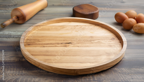 Empty wooden tray on rustic table. Food ingredient. Side view, kitchen concept; for your products; top focus