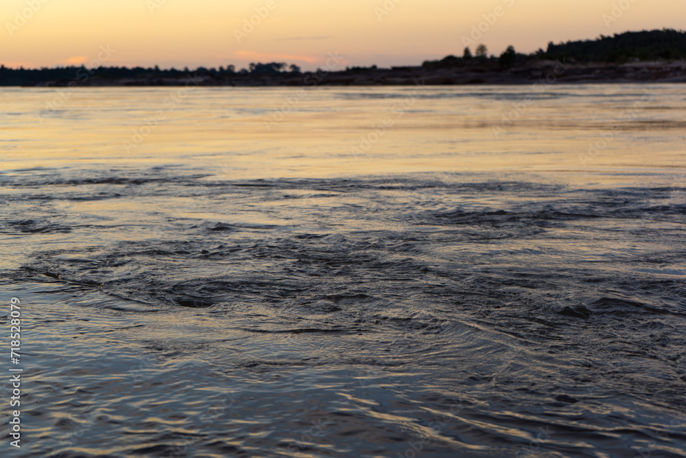 Surface of Mekong river at dusk Surface of Mekong river at dusk