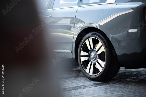 Luxury rear side car with wheel selective focus © Sorawit