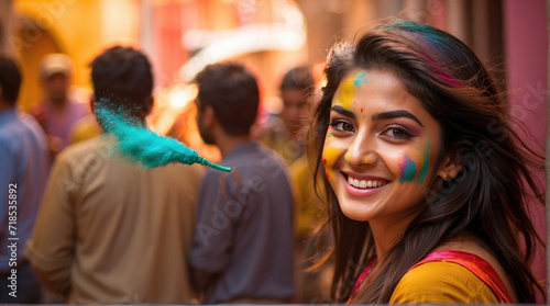 beautiful woman enjoying The Hindu festival Holi, india