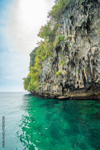 Granite marble rock structure surface of natural mountain's cliff and cave, the beautiful sea in Andaman Sea, Koh Waen, Koh Chueak, Trang Thailand.