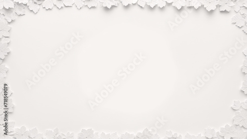a white paper frame surrounded by leaves on a white background