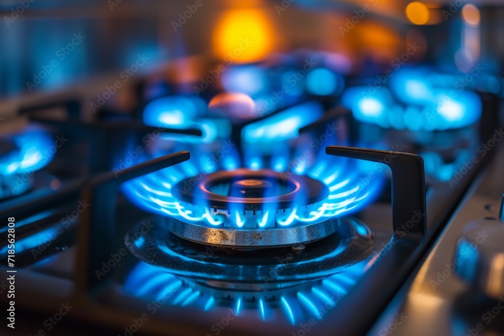 Blue kitchen gas stove flame in kitchen. Blue kitchen gas stove flame in kitchen.