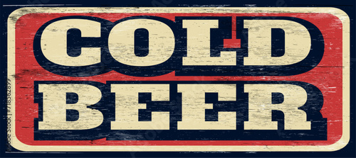 Grunge retro cold beer sign on wood