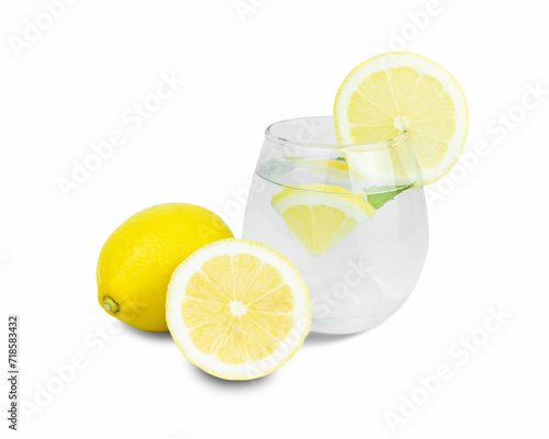 Infused water with some lemon slices on white background