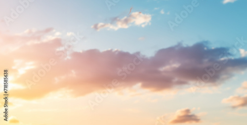 sunset sky with clouds, woman running in a park wearing sport clothes